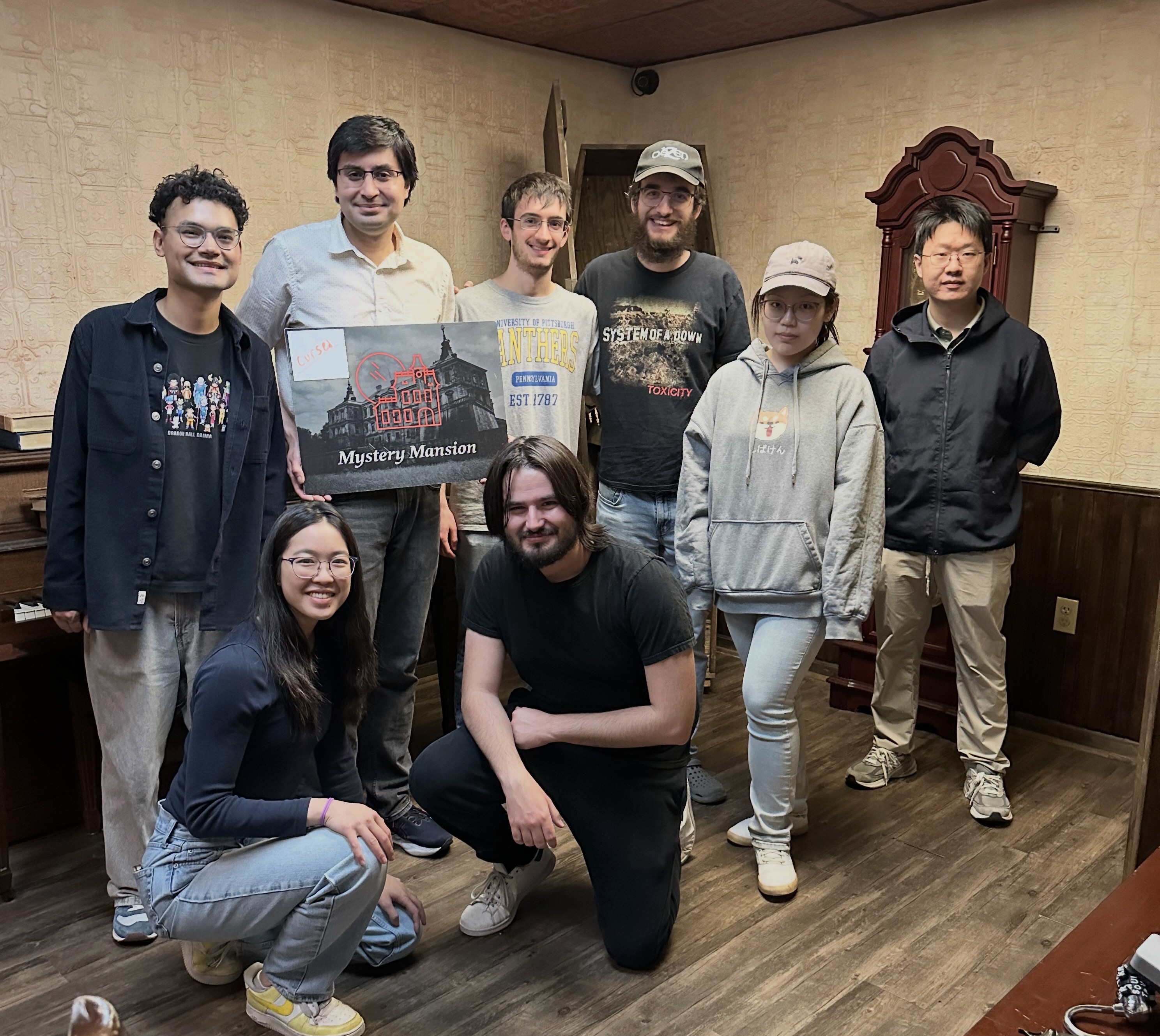 Group photo from the lab's escape room outing.